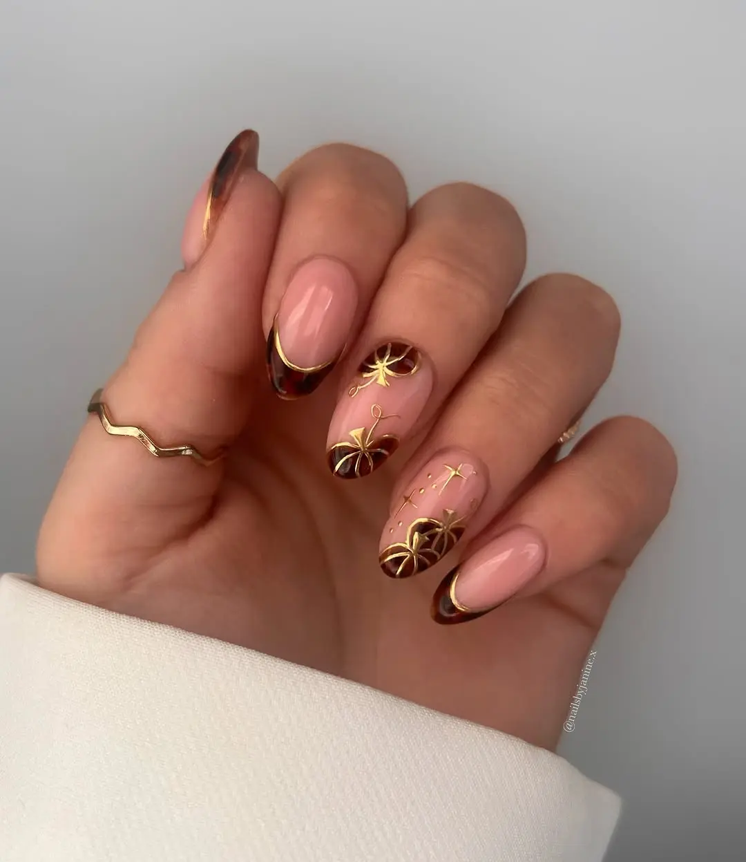 Elegant pumpkin-themed nail art for fall