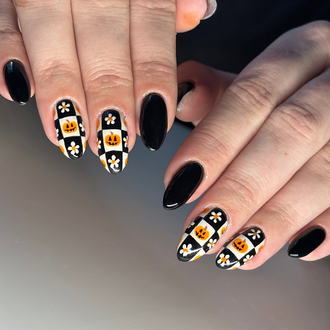 Chic black and orange pumpkin nail art