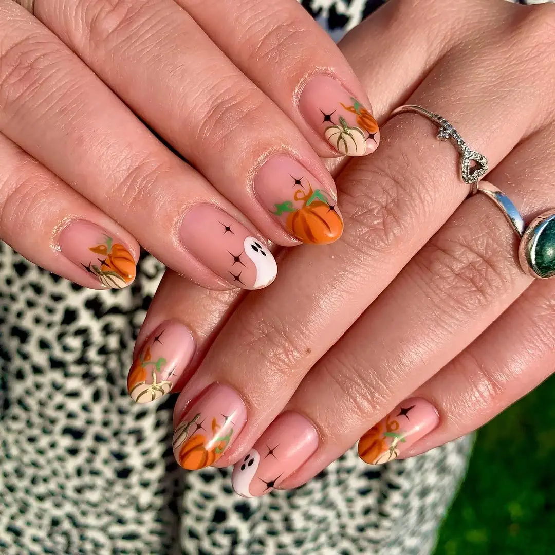 Charming pumpkin-themed nail art for autumn vibes