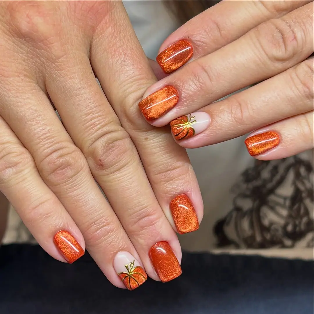 Stunning autumn-inspired pumpkin nail design