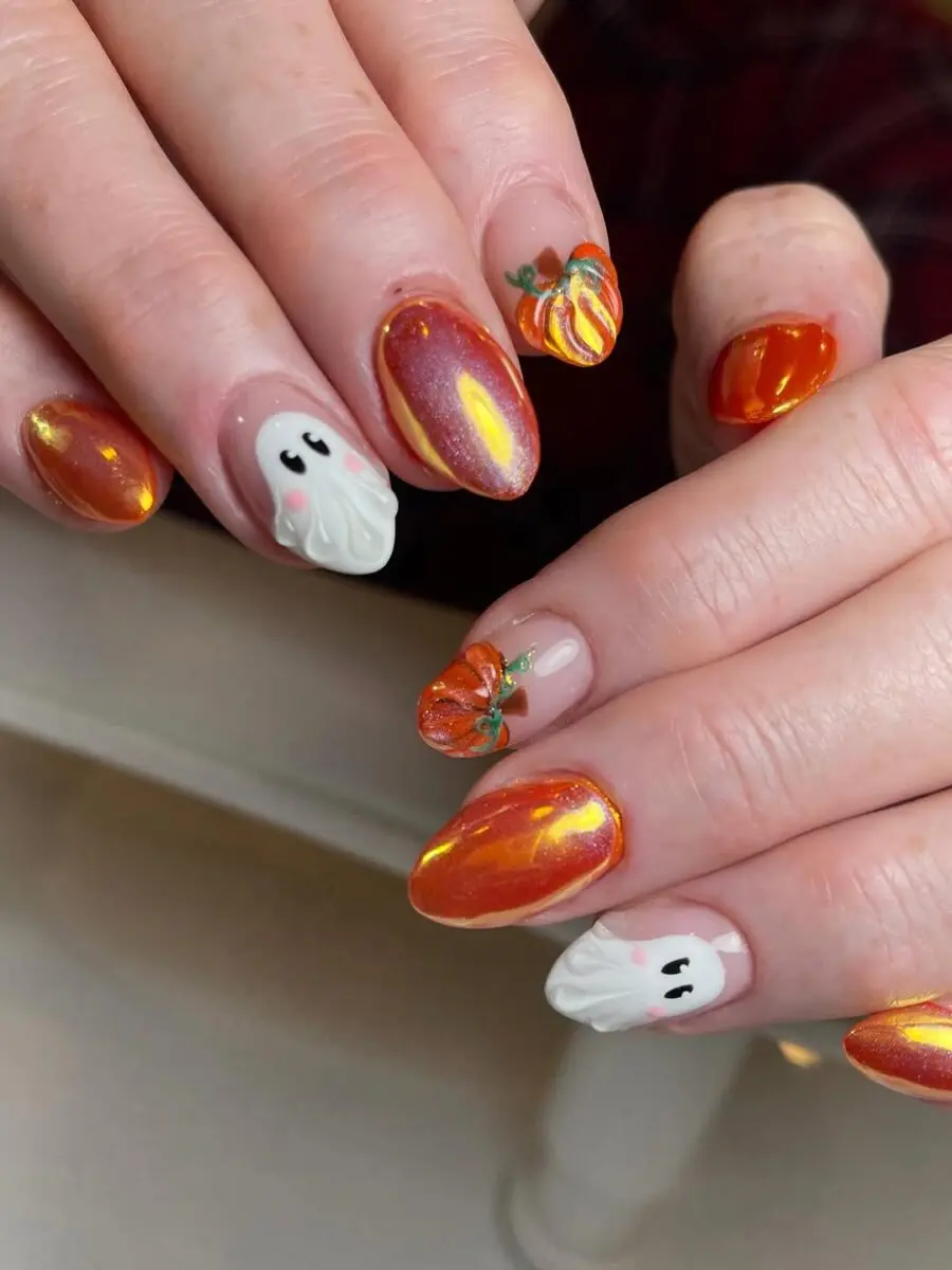 Festive pumpkin and ghost nail art for fall