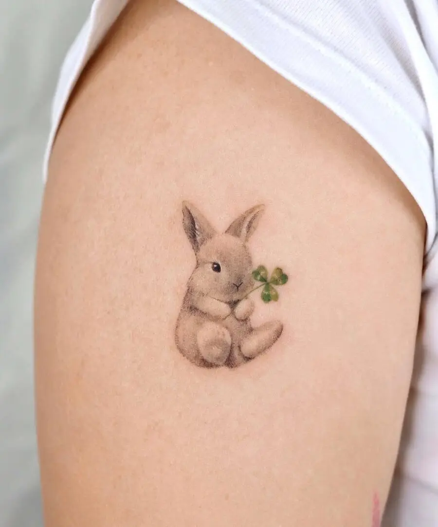 Charming rabbit tattoo with clover symbol