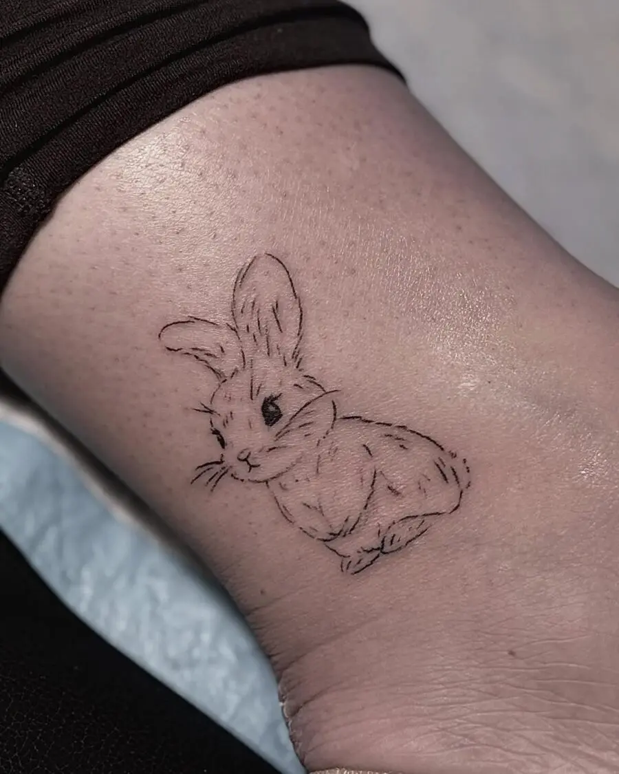 Charming minimalist rabbit tattoo design