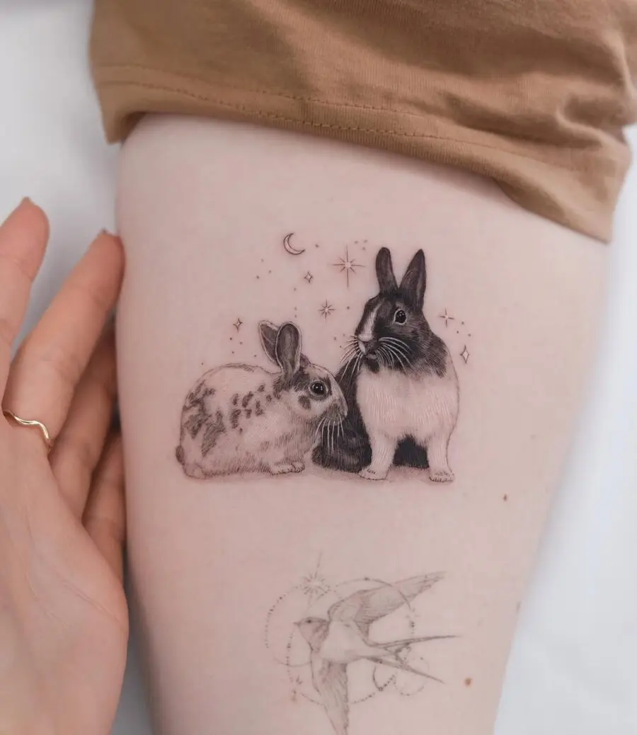 Charming rabbits tattoo showcasing intricate detailing