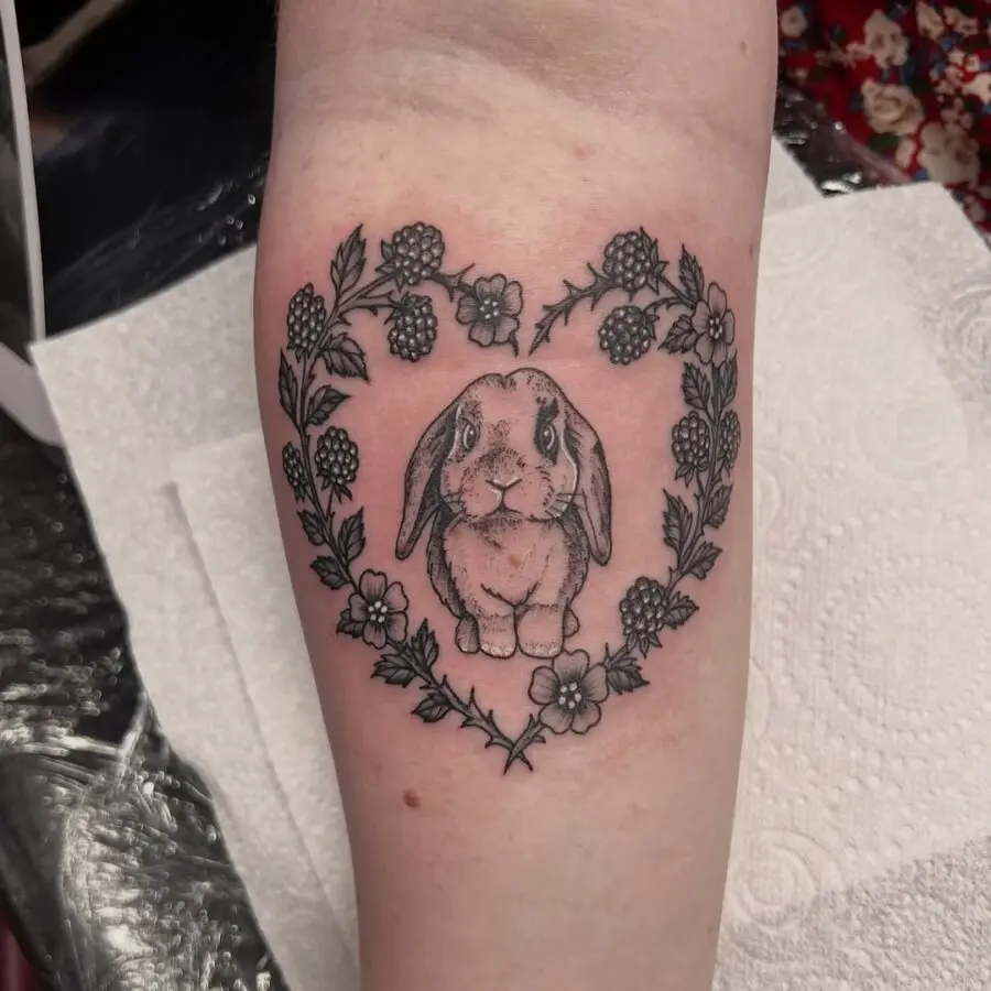Charming heart-shaped rabbit tattoo design