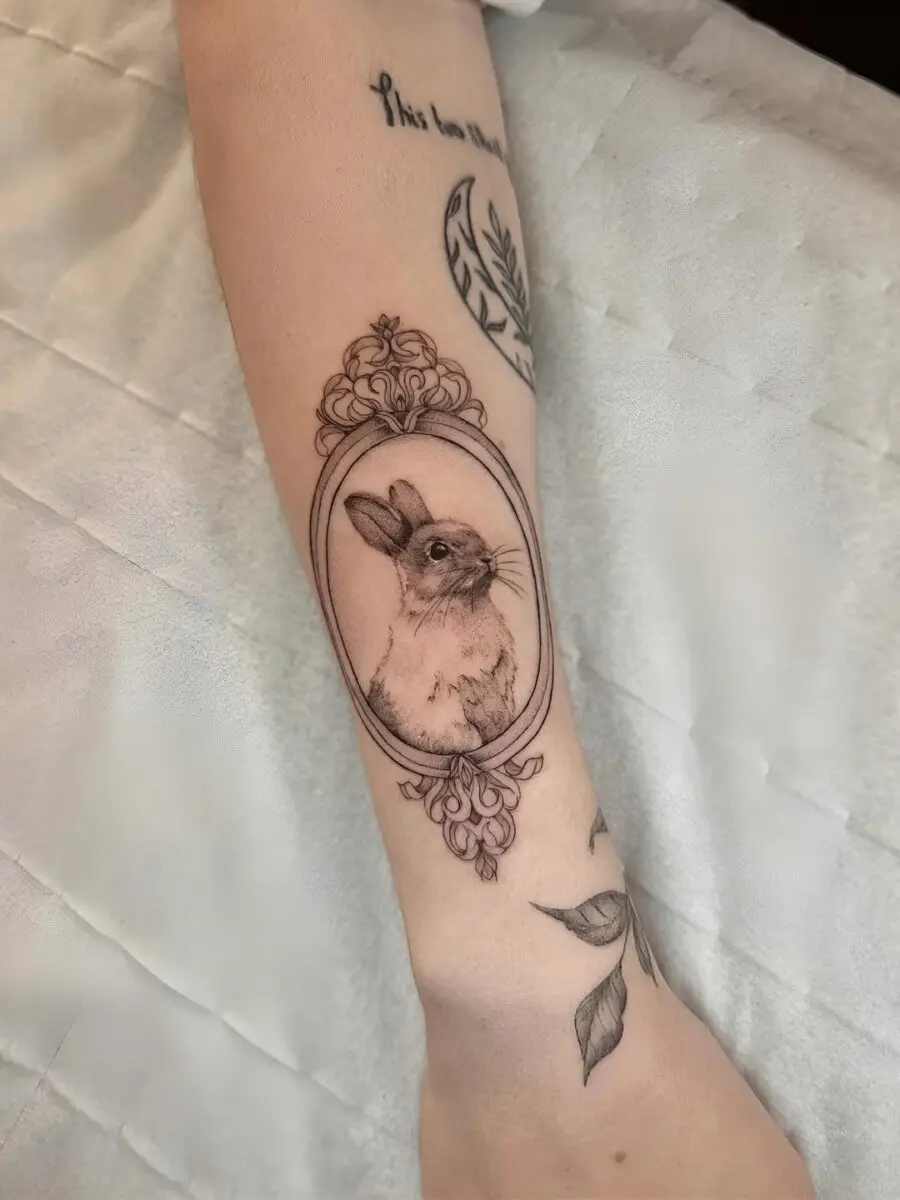 Framed rabbit tattoo with elegant detail