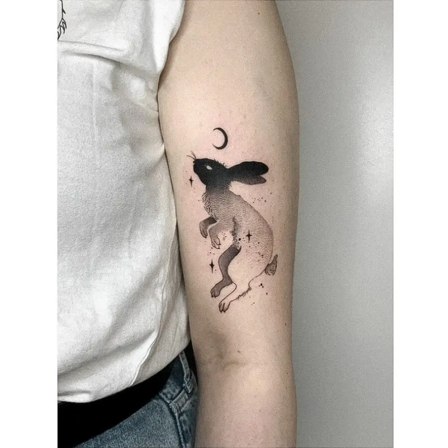 Enchanting rabbit tattoo with celestial elements