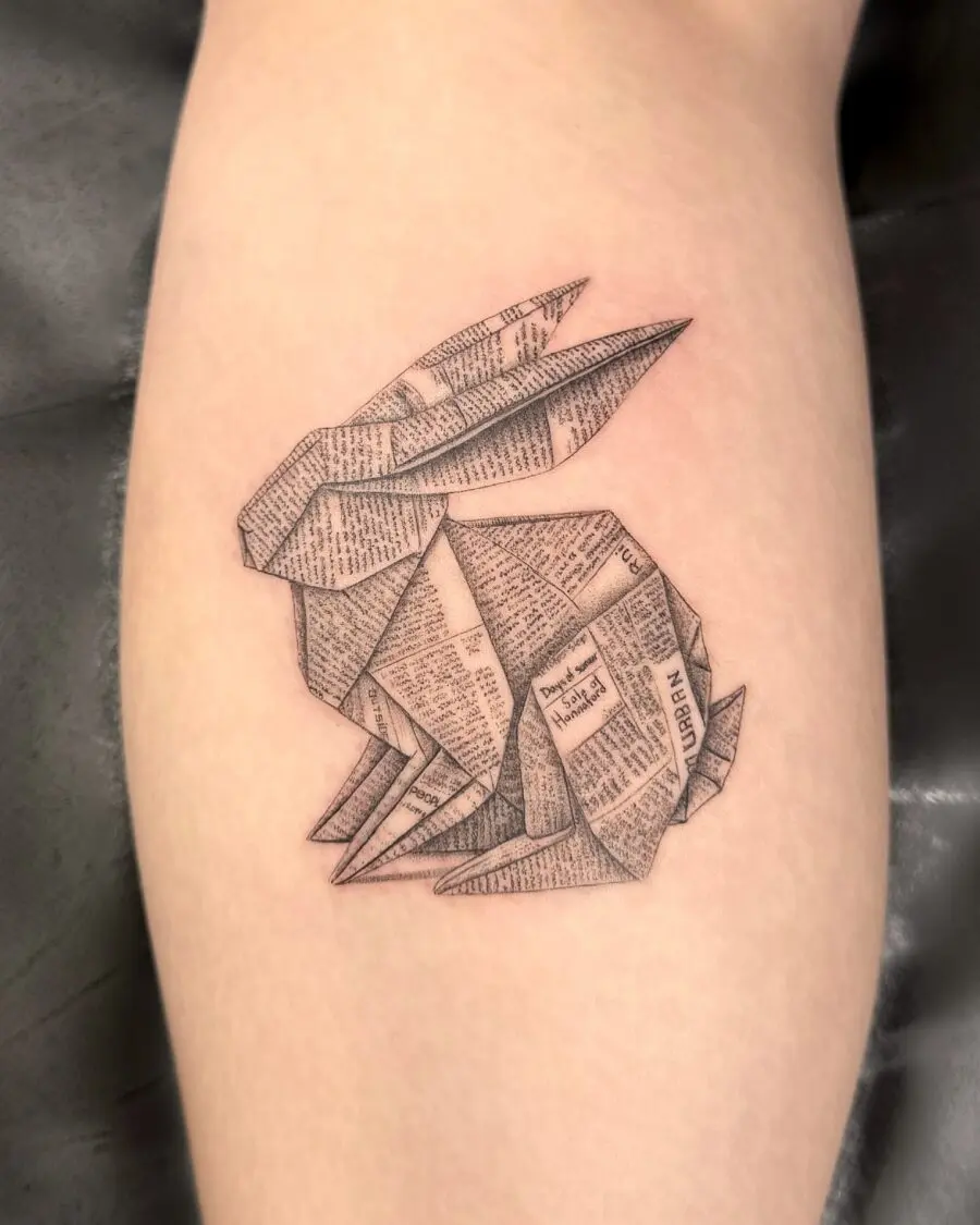 Elegant origami rabbit tattoo in newspaper style