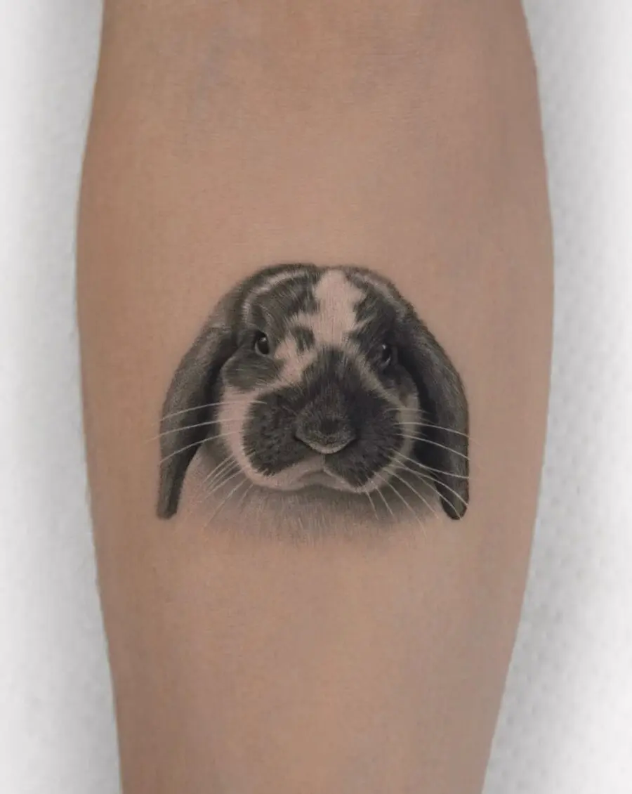 Detailed black and gray rabbit tattoo design