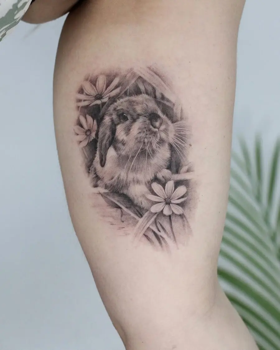Elegant rabbit tattoo showcasing floral elements