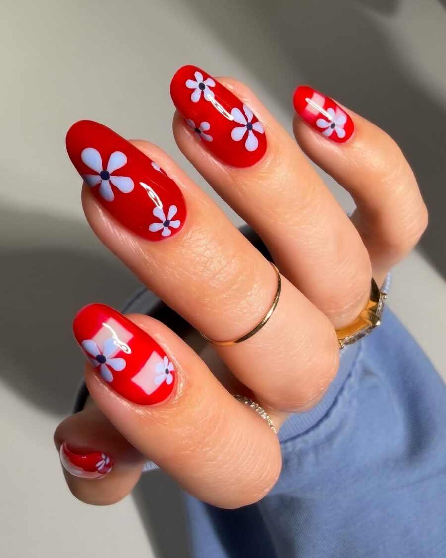 Bright red nails with playful flower designs