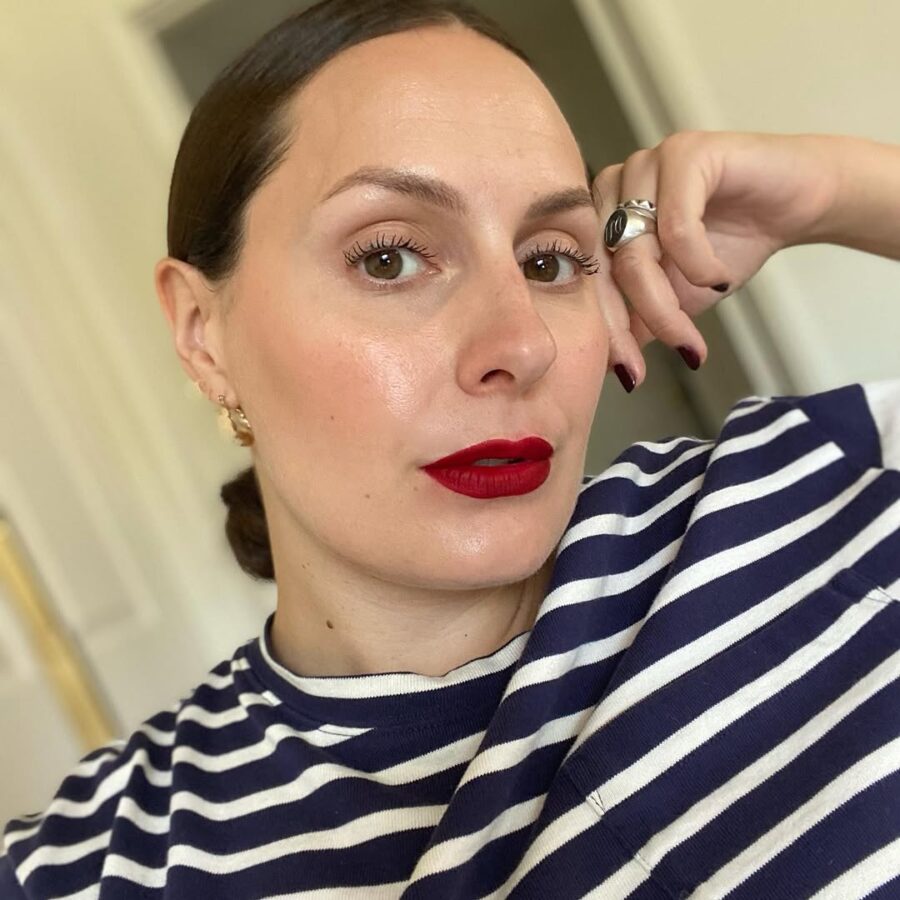 Bold red lips with a chic, casual vibe