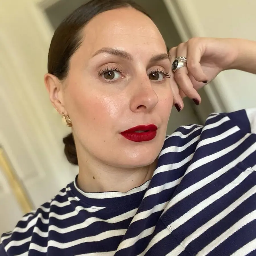 Bold red lips with a chic, casual vibe