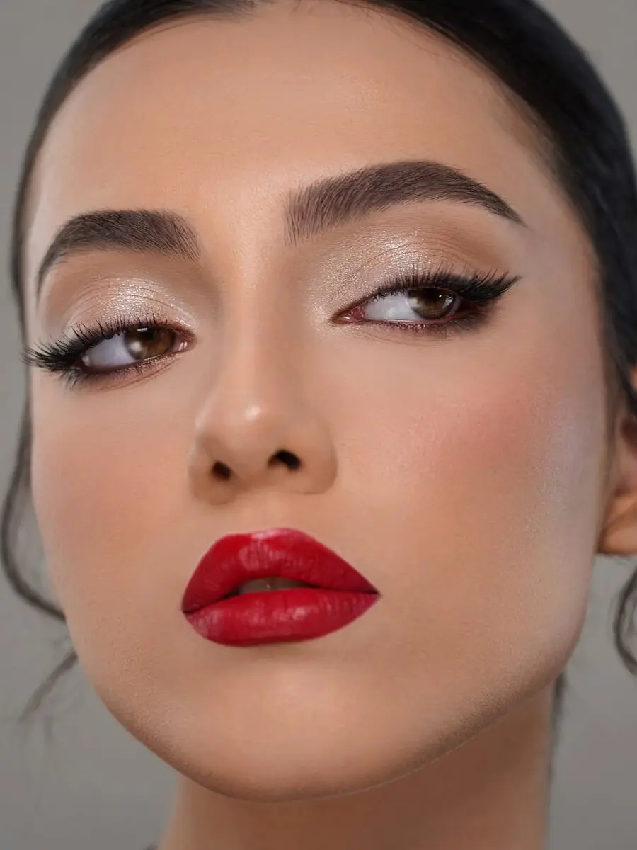 Bold red lipstick with glam eye makeup