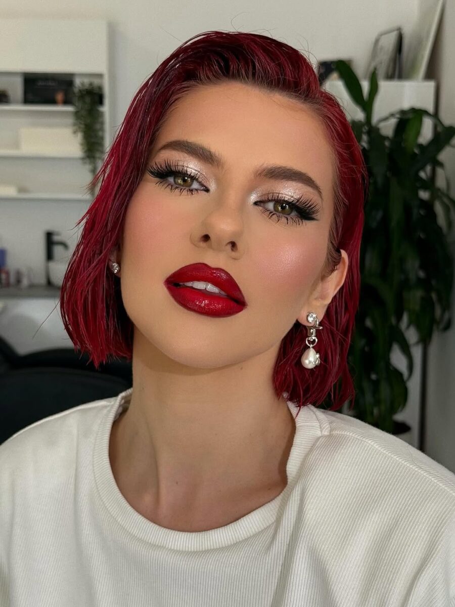 Bold red lips paired with striking lashes