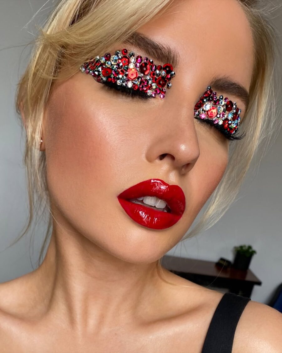 Glamorous red lipstick with bold embellishments