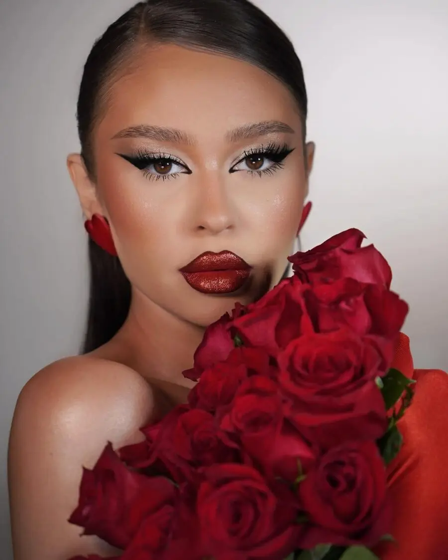 Sophisticated red lipstick with rose-themed vibes