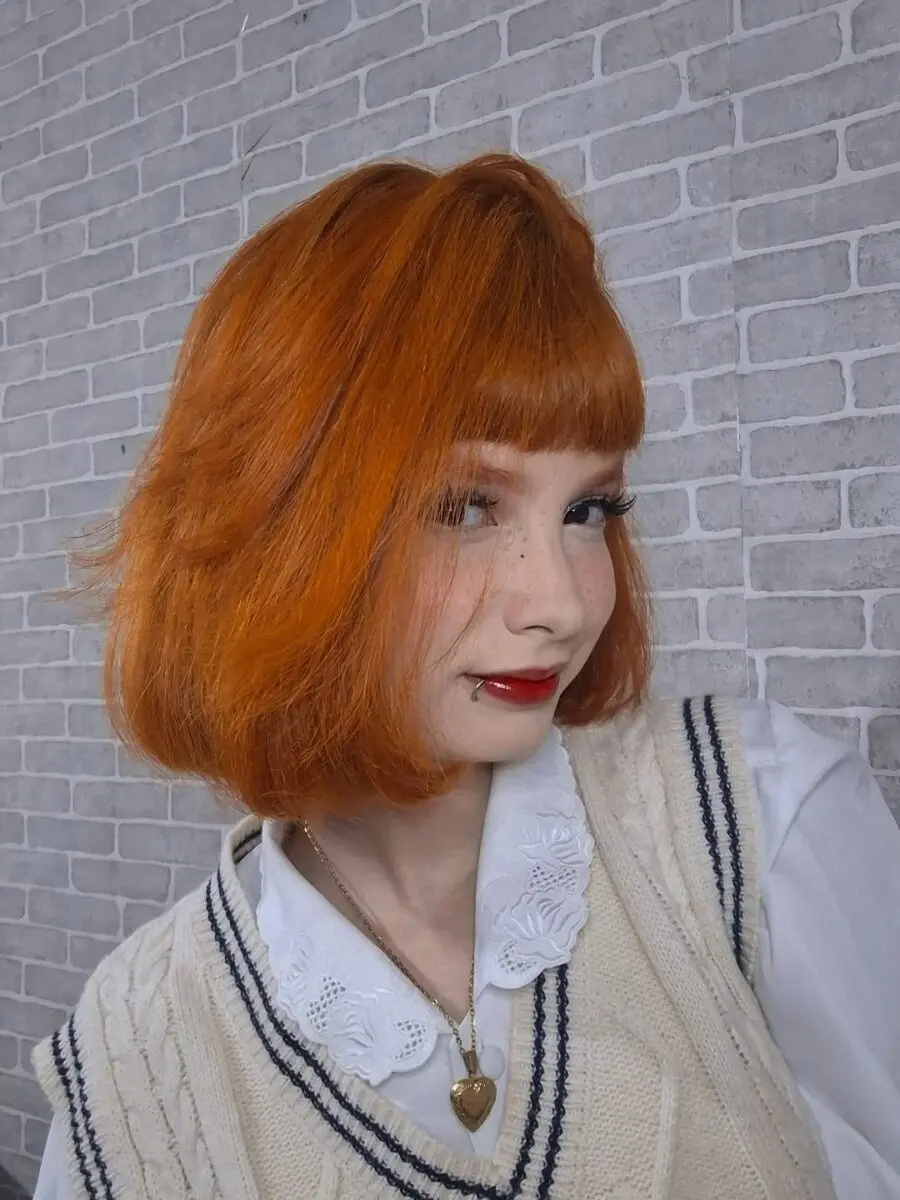 Bold red lips paired with orange hair