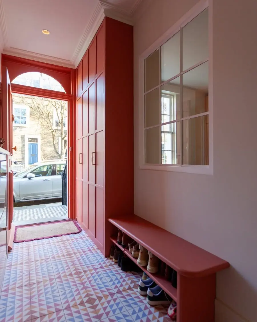 Chic shoe storage in a vibrant entryway