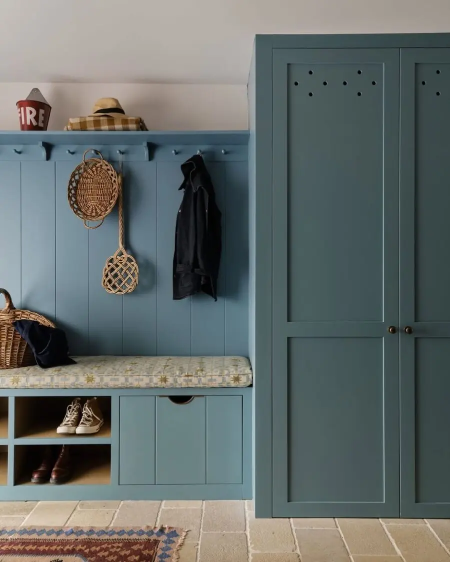Stylish blue shoe storage with cozy detailing