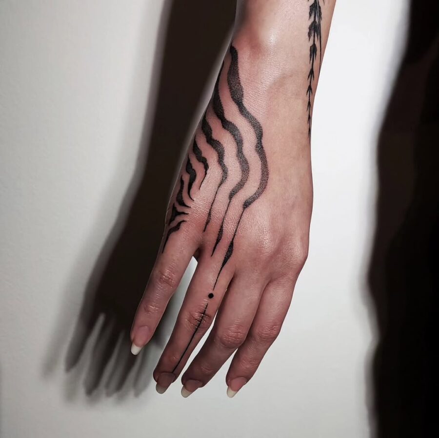 Elegant and abstract side hand tattoo design