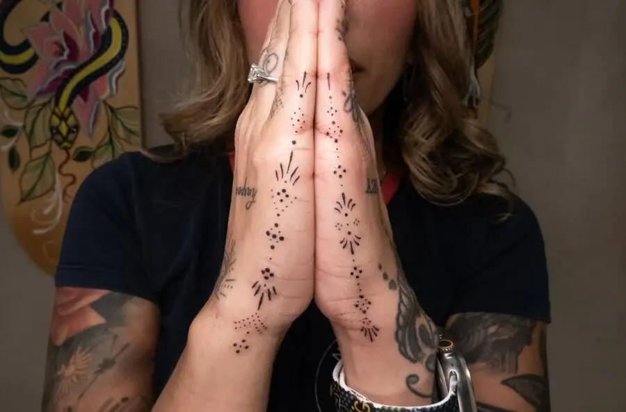 Elegant side hand tattoos with a spiritual touch