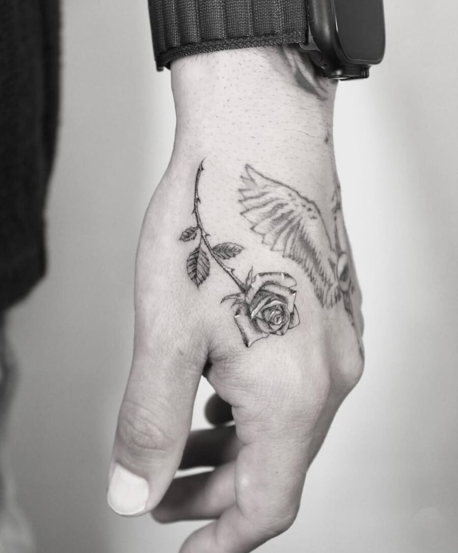 Stylish rose and owl side hand tattoo