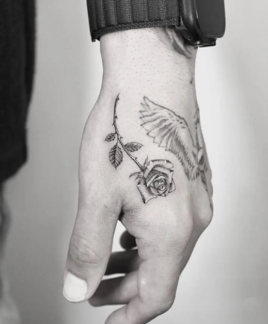 Stylish rose and owl side hand tattoo