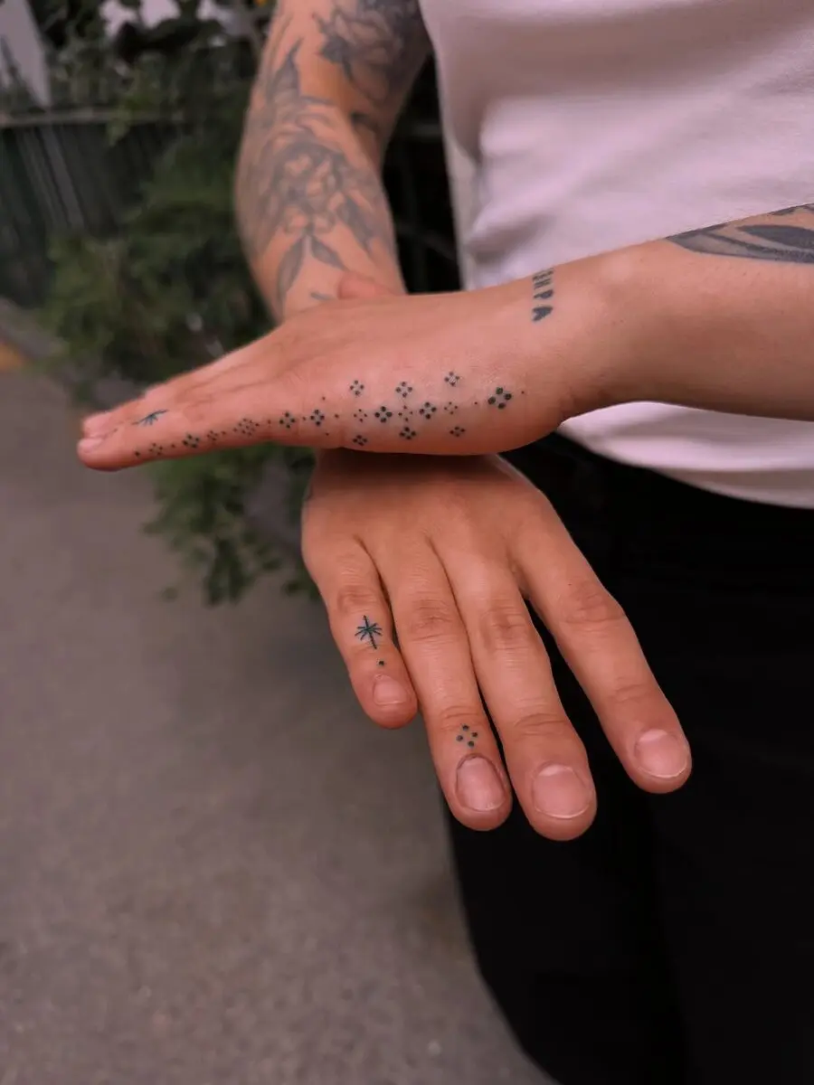 Elegant Floral and Star Themed Side Hand Tattoos