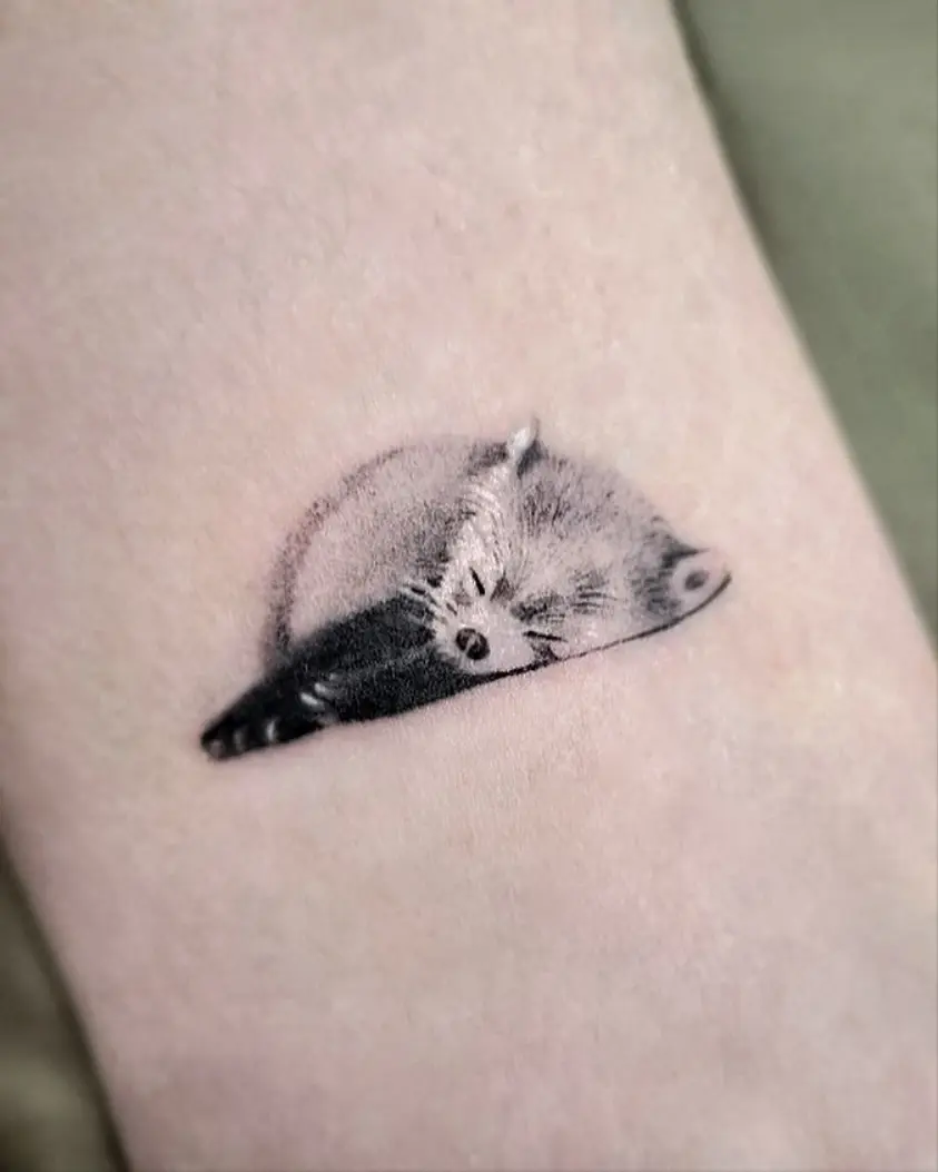 Elegant sleeping panda tattoo captures serene vibes