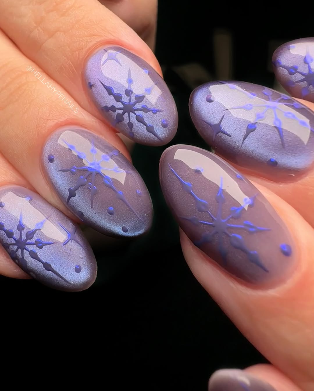 Elegant Purple Snowflake Nail Art Design