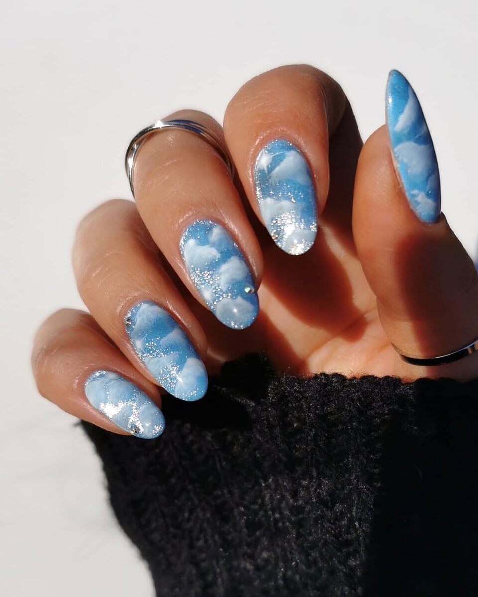 Charming winter-inspired blue snowflake nails