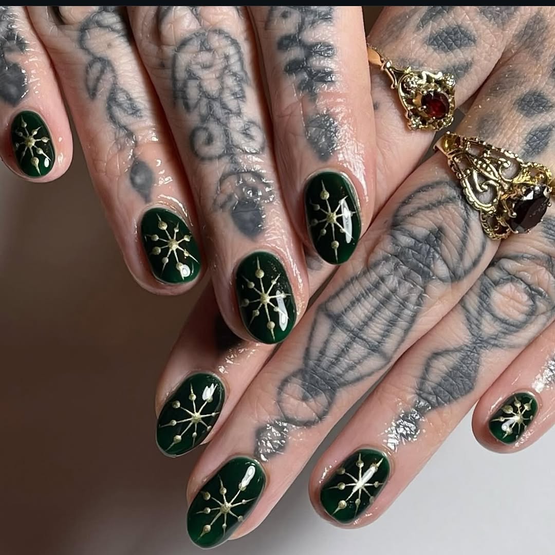 Elegant dark green snowflake nail design