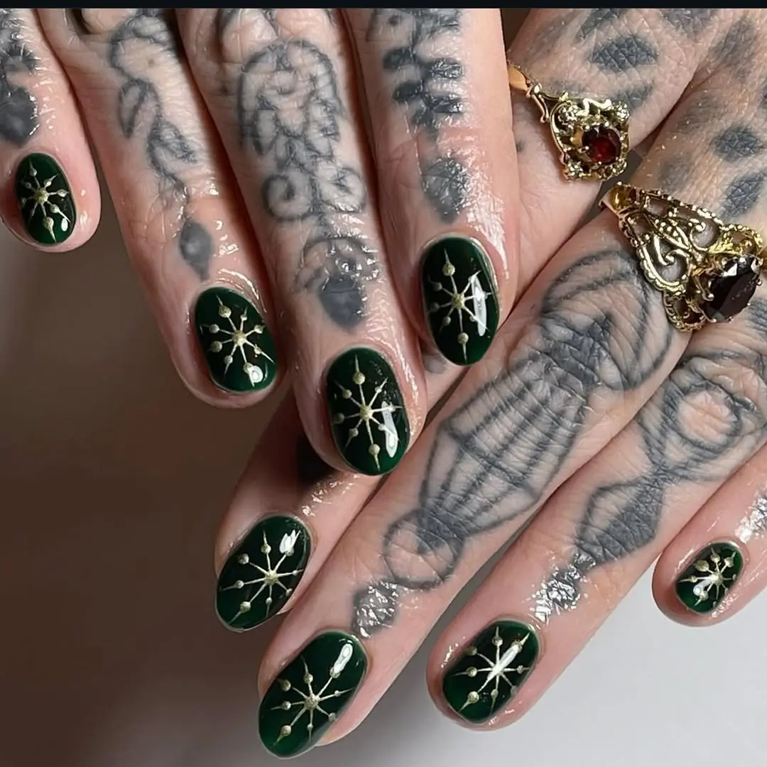 Elegant dark green snowflake nail design