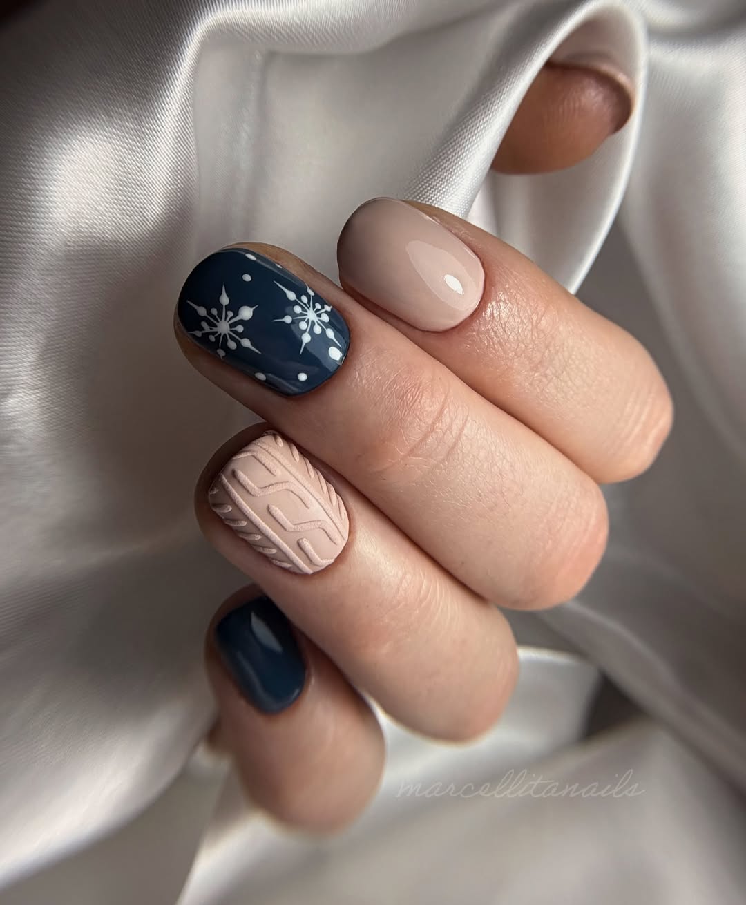 Charming snowflake nails in dark and light hues
