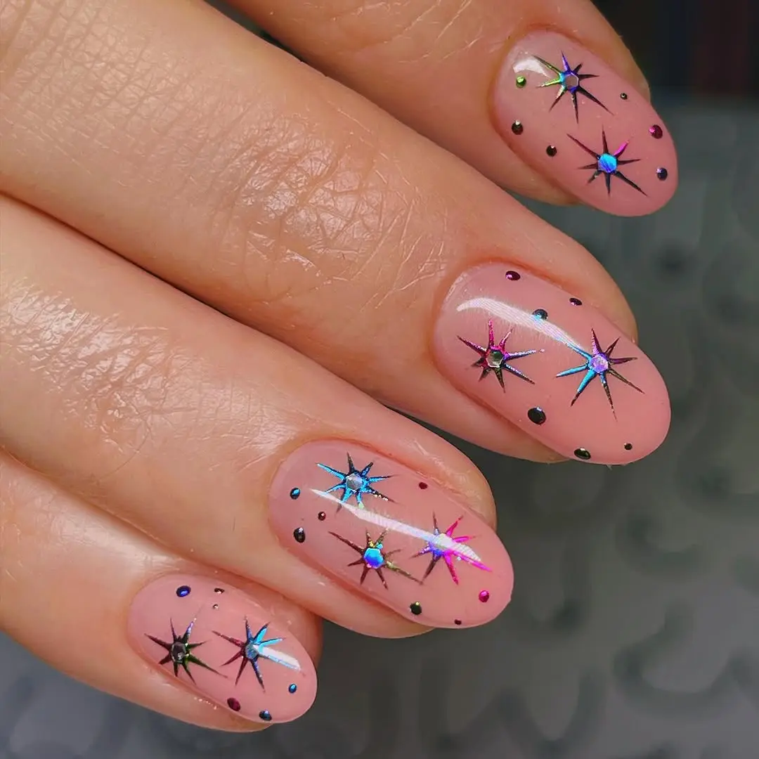 Glistening snowflake nails with starry accents