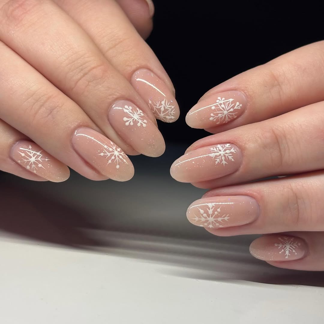 Charming snowflake art on neutral nails