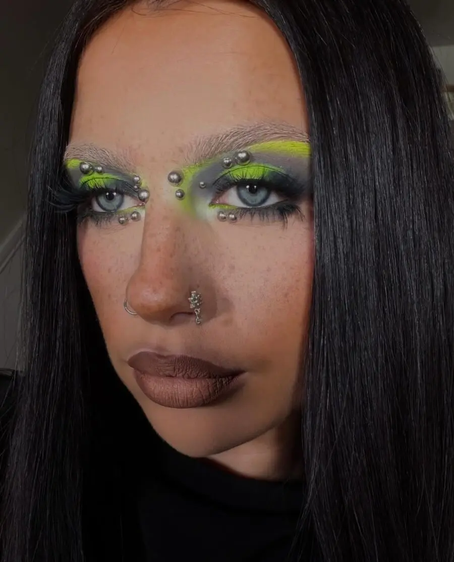 Bold neon accentuates grunge-inspired makeup style