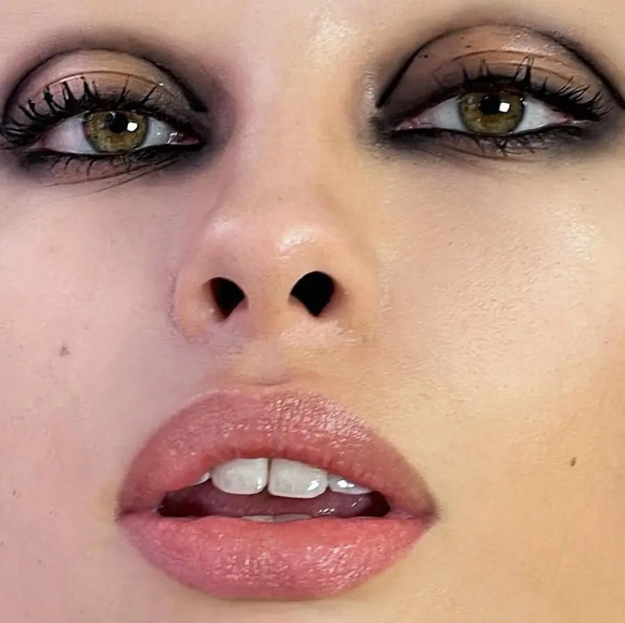 Moody eyes with soft, nude lips