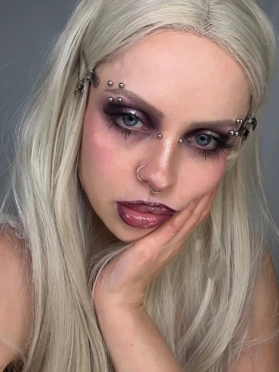 Soft grunge makeup with bold purple accents