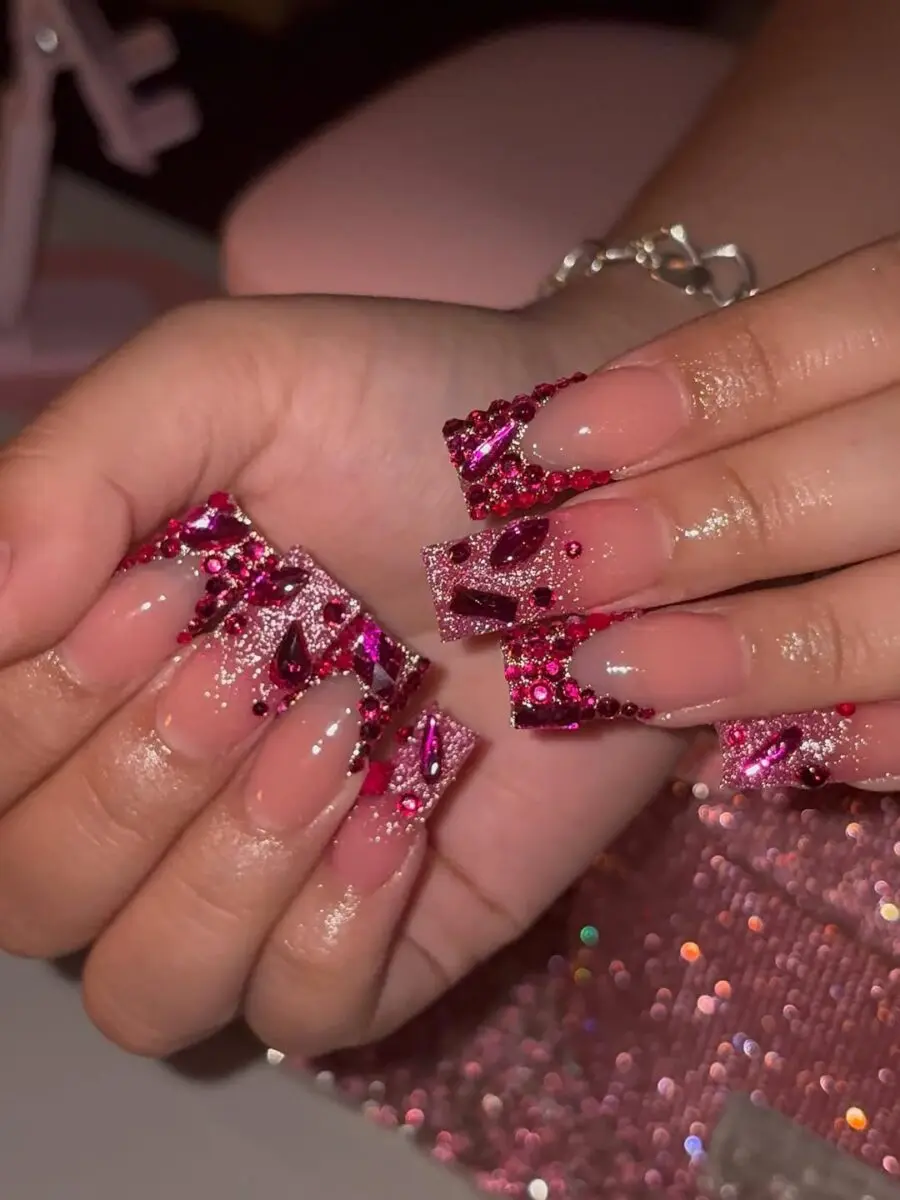 Glamorous pink prom nails adorned with rhinestones