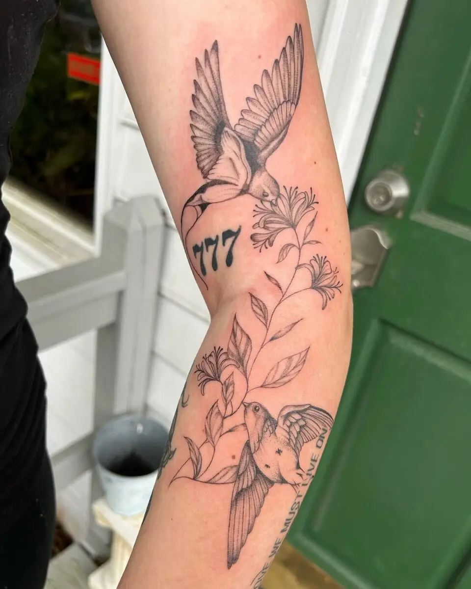 Elegant sparrow tattoo with floral details
