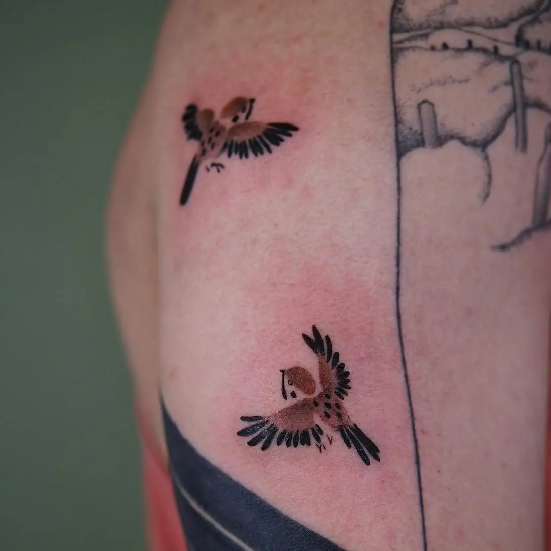 Dynamic sparrow tattoos depicting freedom and grace