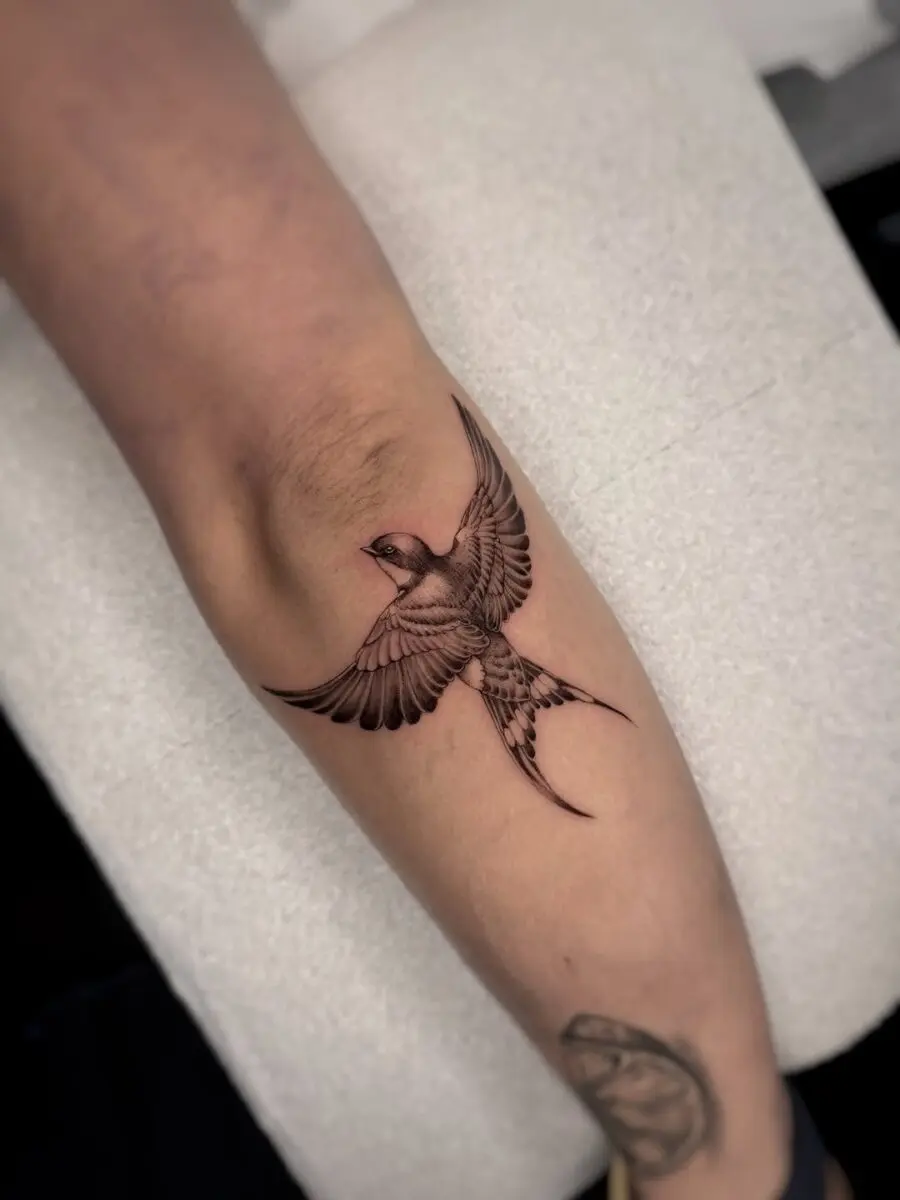 Elegant Sparrow Tattoo in Flight