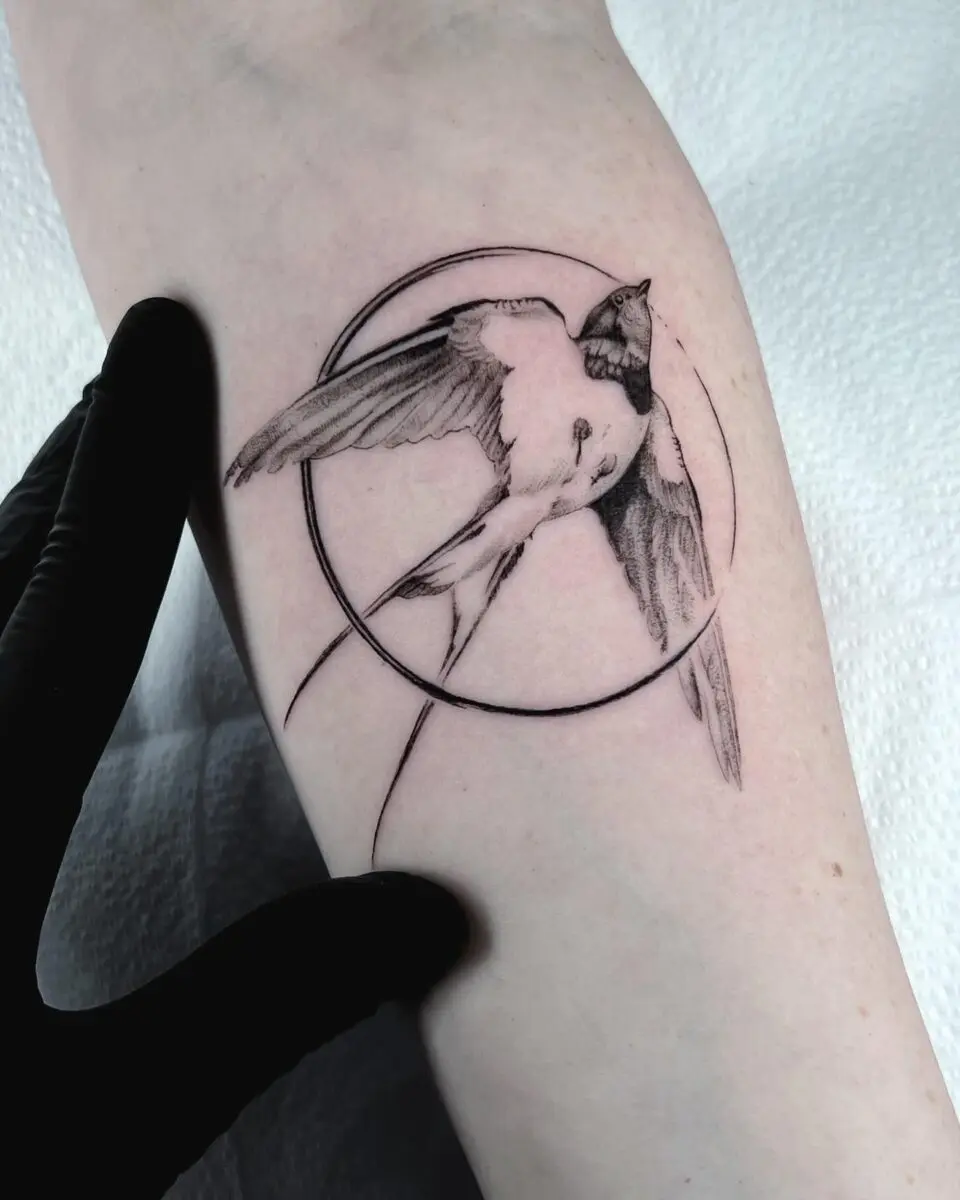 Elegant Sparrow with Circular Design Tattoo