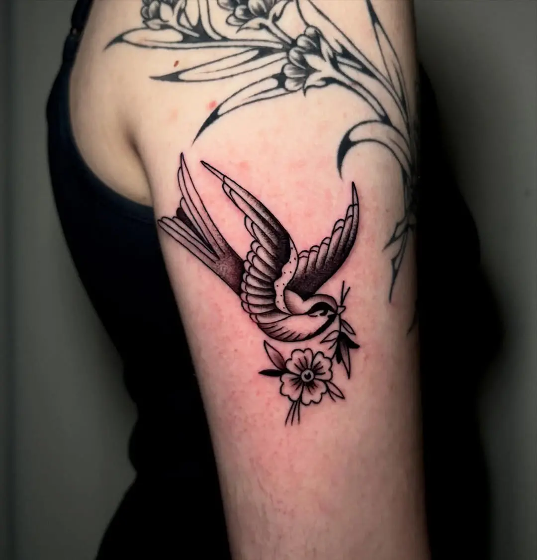 Elegant sparrow tattoo with floral elements