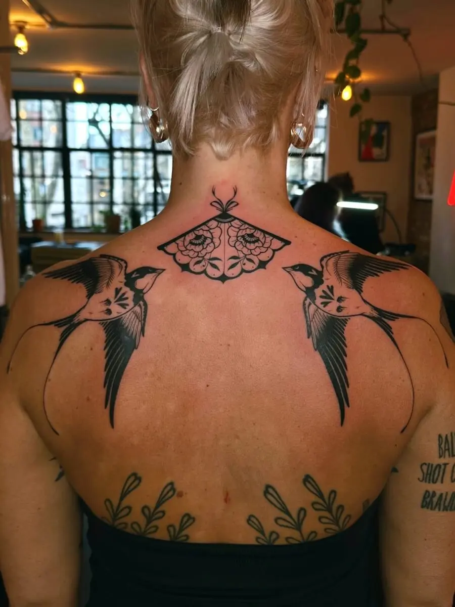 Elegant sparrow tattoos with a butterfly motif