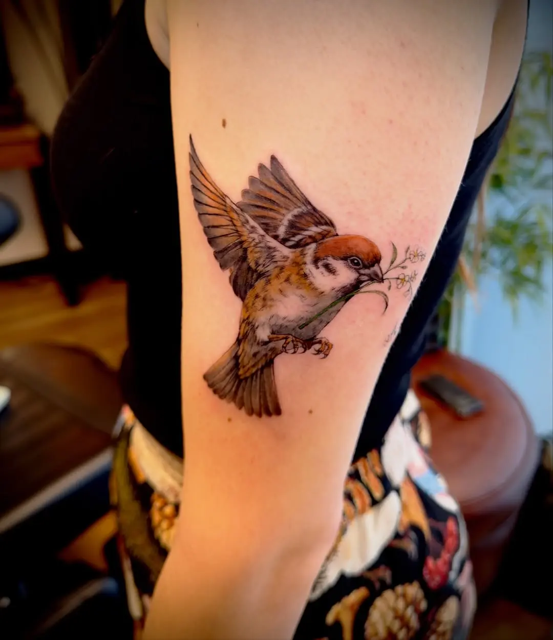 Elegant Sparrow Tattoo with Floral Touch