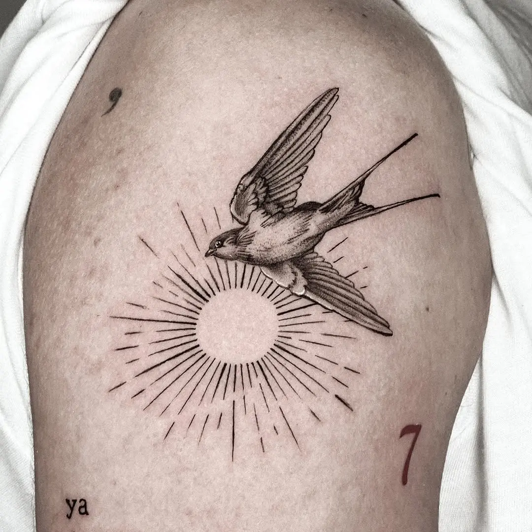 Elegant sparrow tattoo with radiant sun design