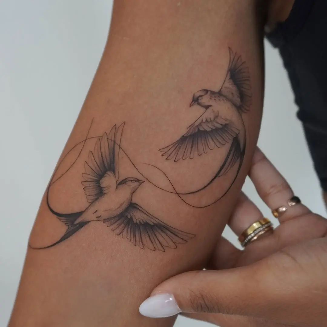 Elegant sparrow tattoos capturing freedom and grace